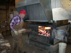 Woodstove boils syrup.